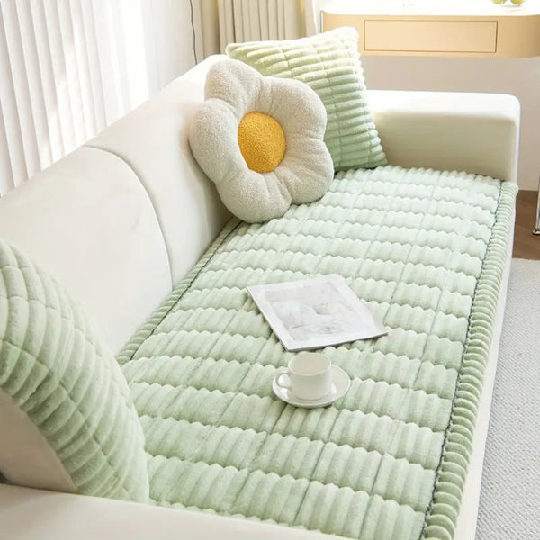 Pleated edge textured sofa cover draped over a sofa