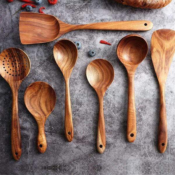 Set of 7 wooden cooking utensils on display