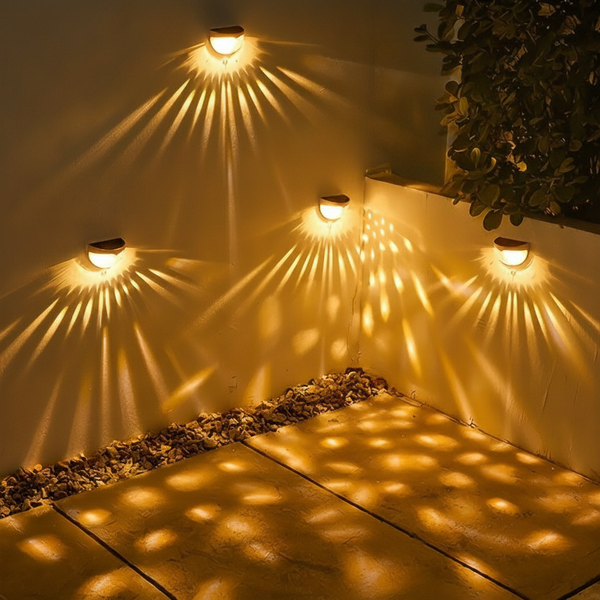 Solar lights on an outdoor wall at night
