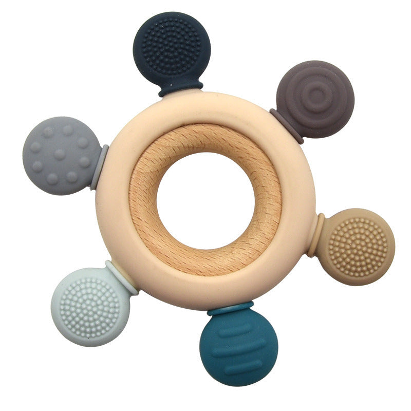 Various colors of the silicone and wood teething ring displayed together.