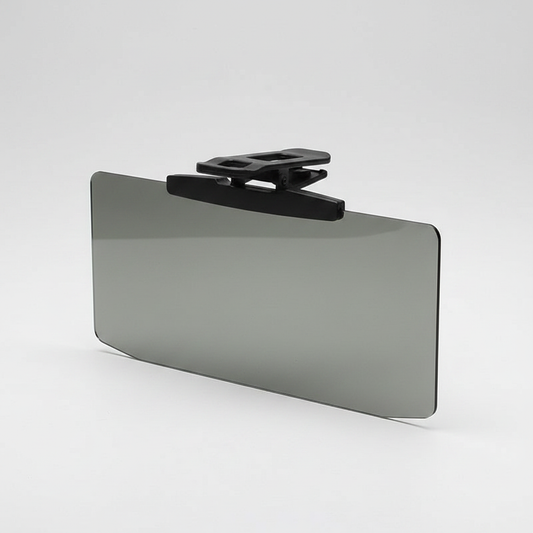 Tinted car anti-glare visor clipped onto a sun visor