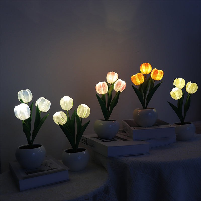 LED tulip lamp turned on in a dark bedroom setting
