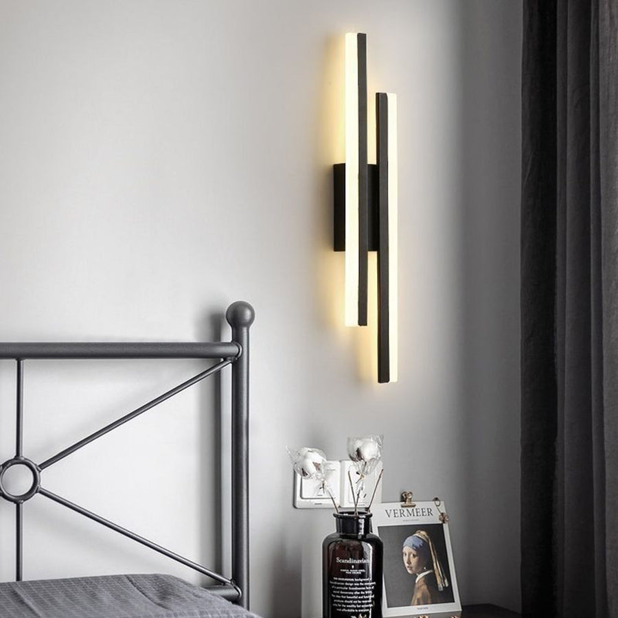 Wall sconce illuminated with cool white light