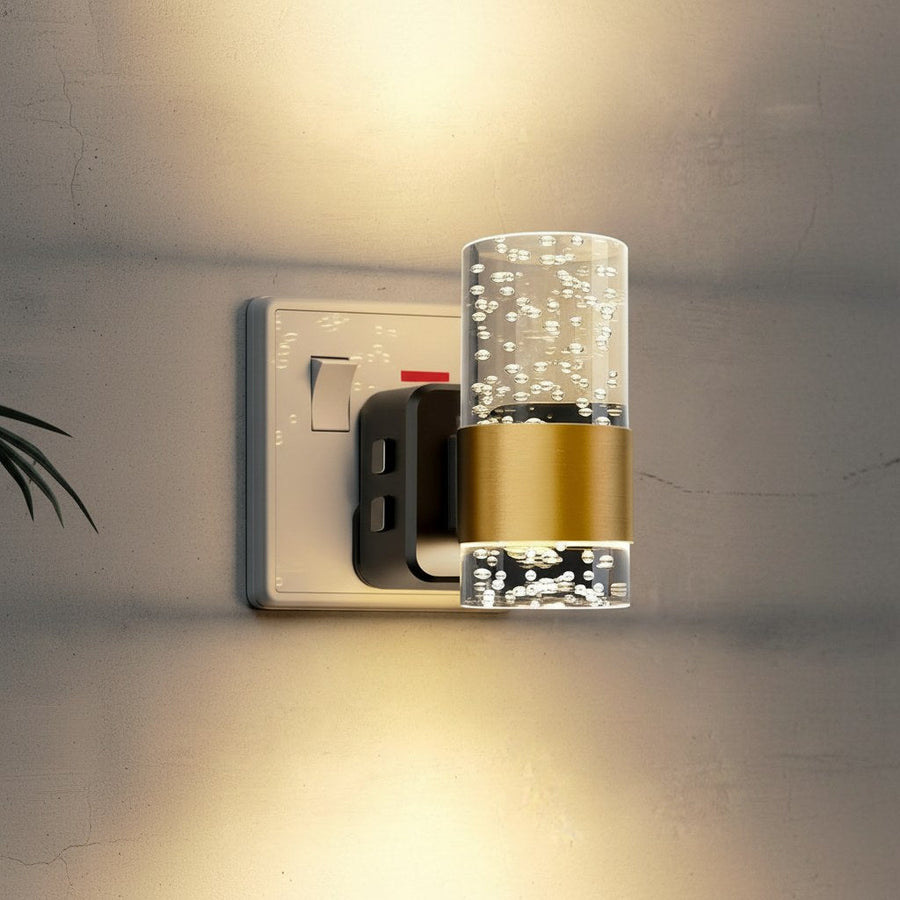 LED night light glowing softly in a dark bedroom