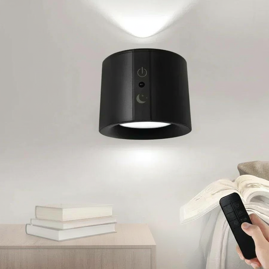 Black LED wall lamp with dual light sources on a nightstand