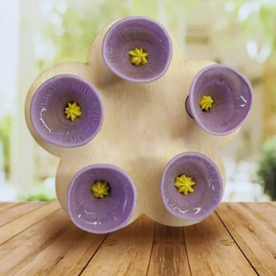 BeeCups placed in a flower bed outdoors