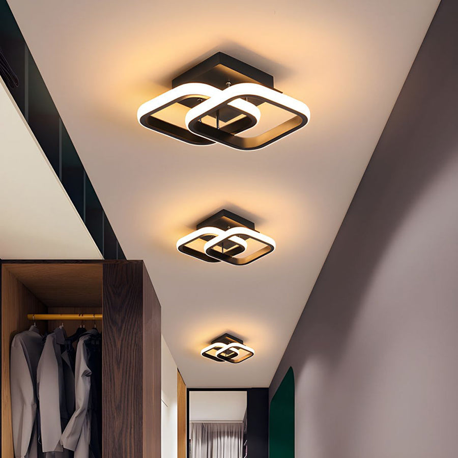 Modern geometric LED ceiling light installed in hallway