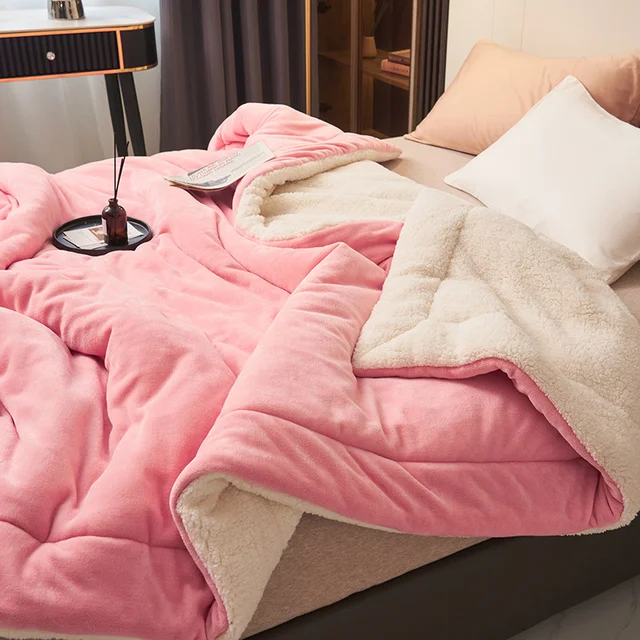 Stack of folded blankets in different colors