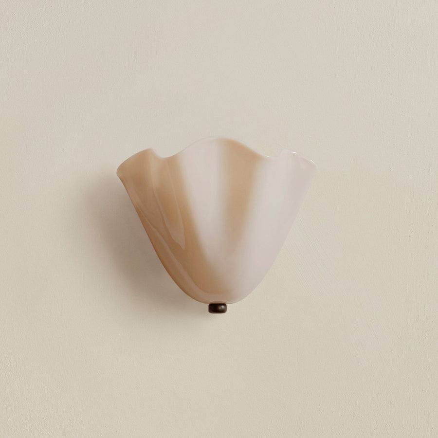 Art Deco shell-shaped LED wall sconce mounted on a wall
