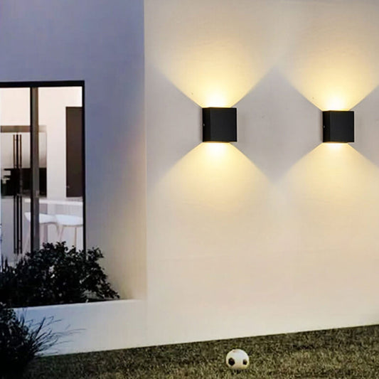 Smart LED outdoor wall lamp mounted on a stone wall