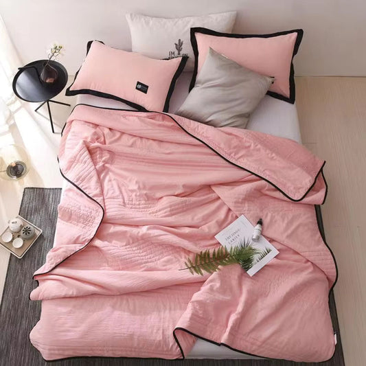 Cooling throw blanket draped over a sofa