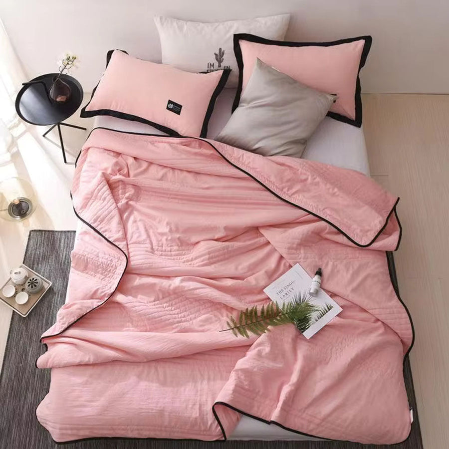 Cooling throw blanket draped over a sofa