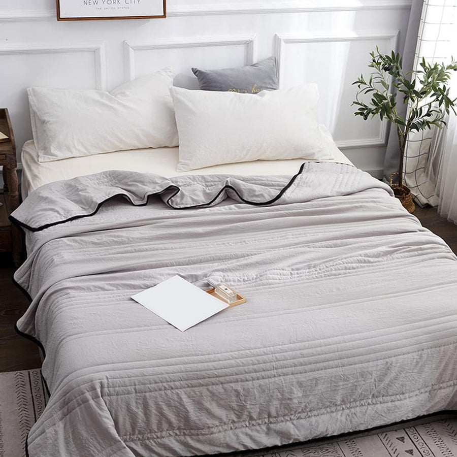 Cooling blanket laid flat on a floor