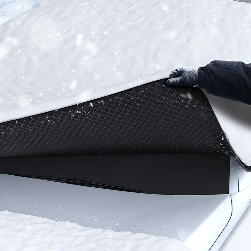 Black magnetic windshield cover on a parked car
