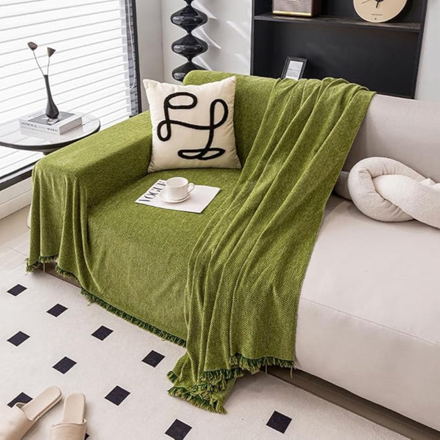 Orange sofa cover draped over an armchair