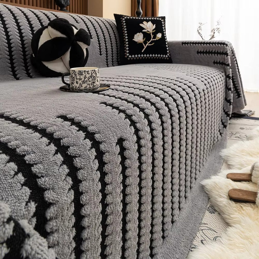 Folded knit sofa cover showing its texture and weight