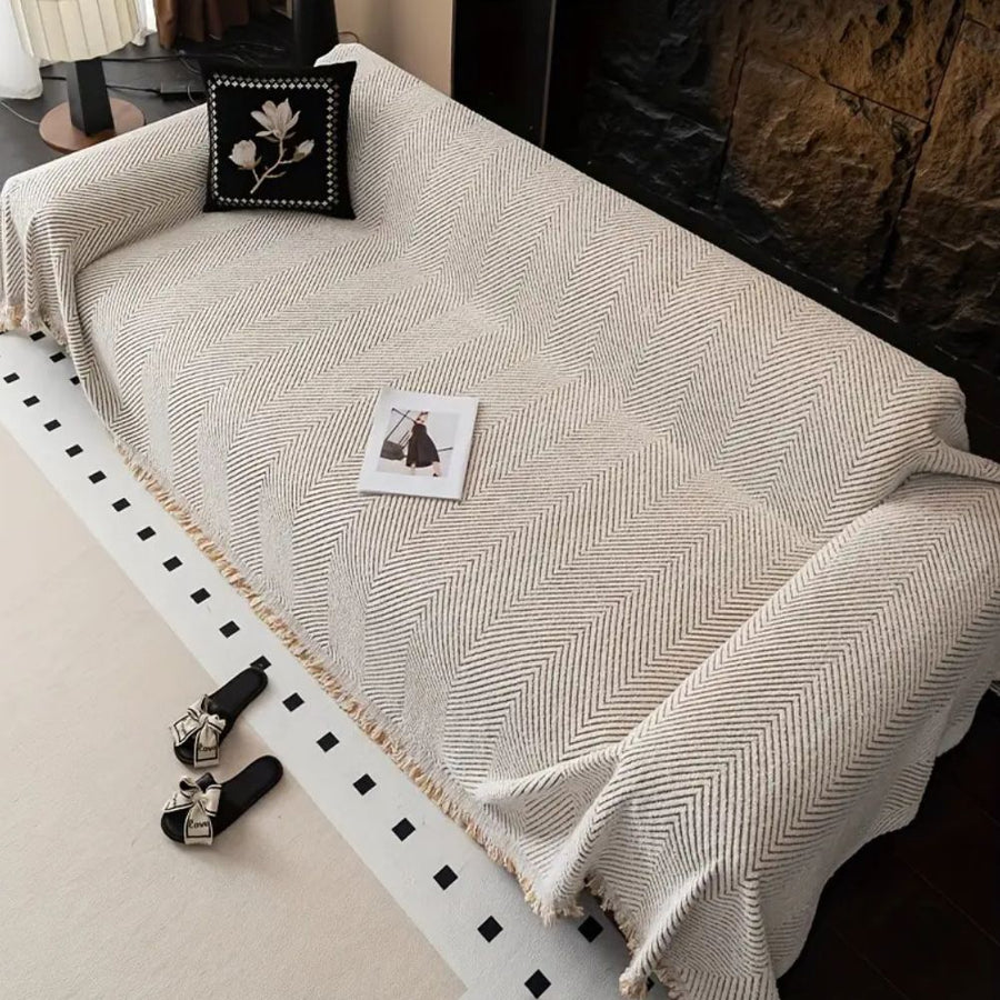 Sofa cover shown fitted on a sofa corner