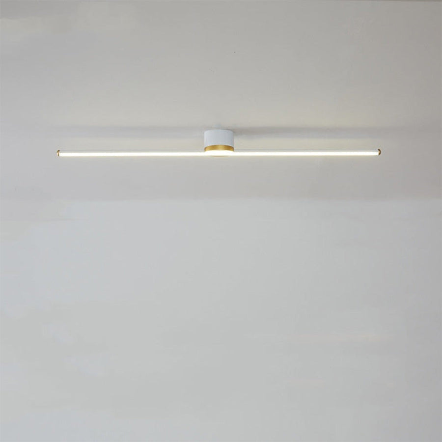 Black linear LED semi-flush ceiling light in a hallway