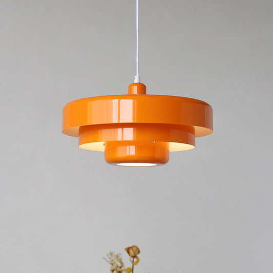 Scandinavian retro pendant light hanging over a dining table