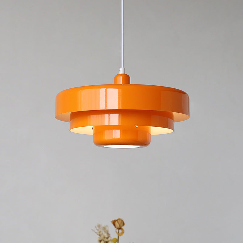 Scandinavian retro pendant light hanging over a dining table