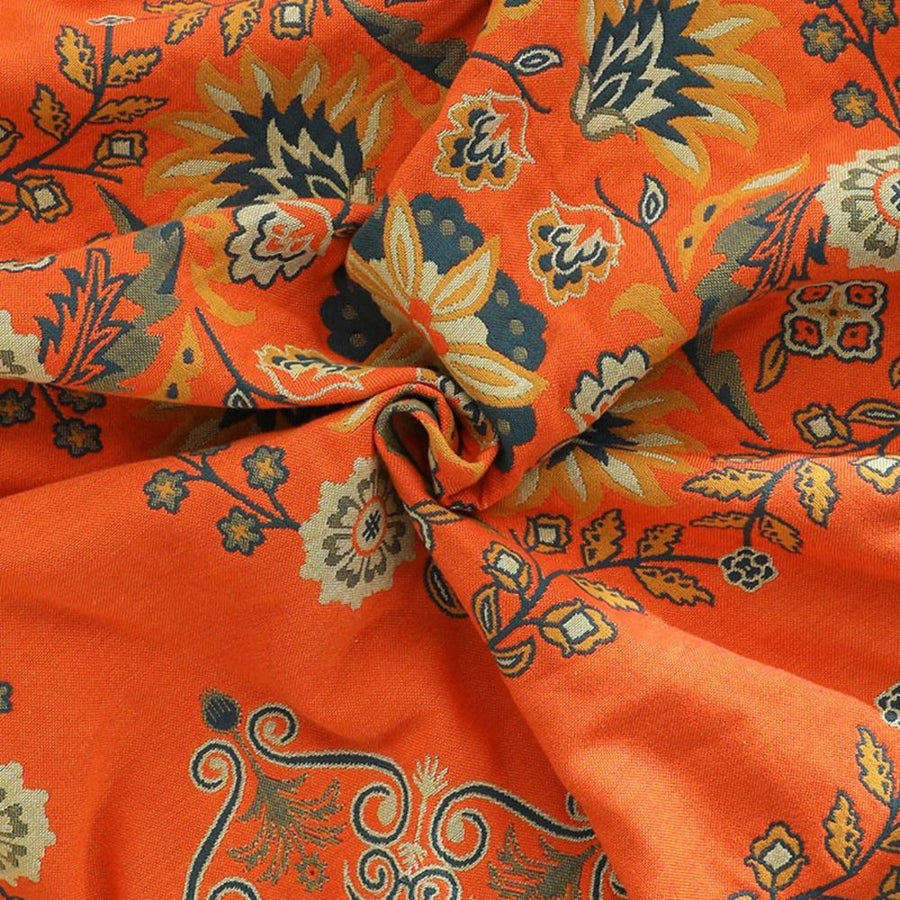 Marigold reversible throw blanket on a sofa