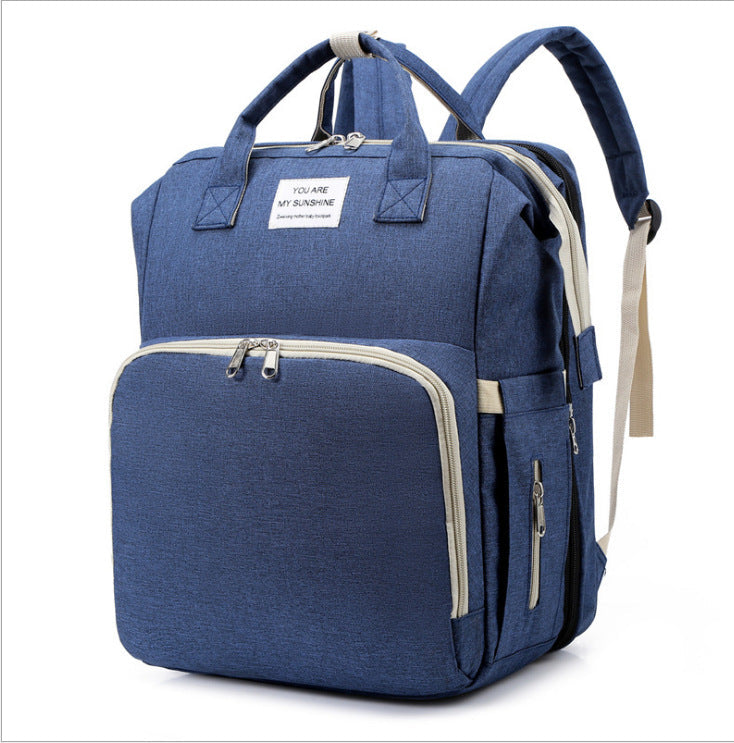Diaper bag backpack packed with baby essentials.
