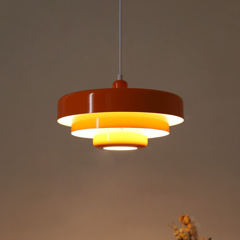 Retro pendant light in a bedroom above a nightstand