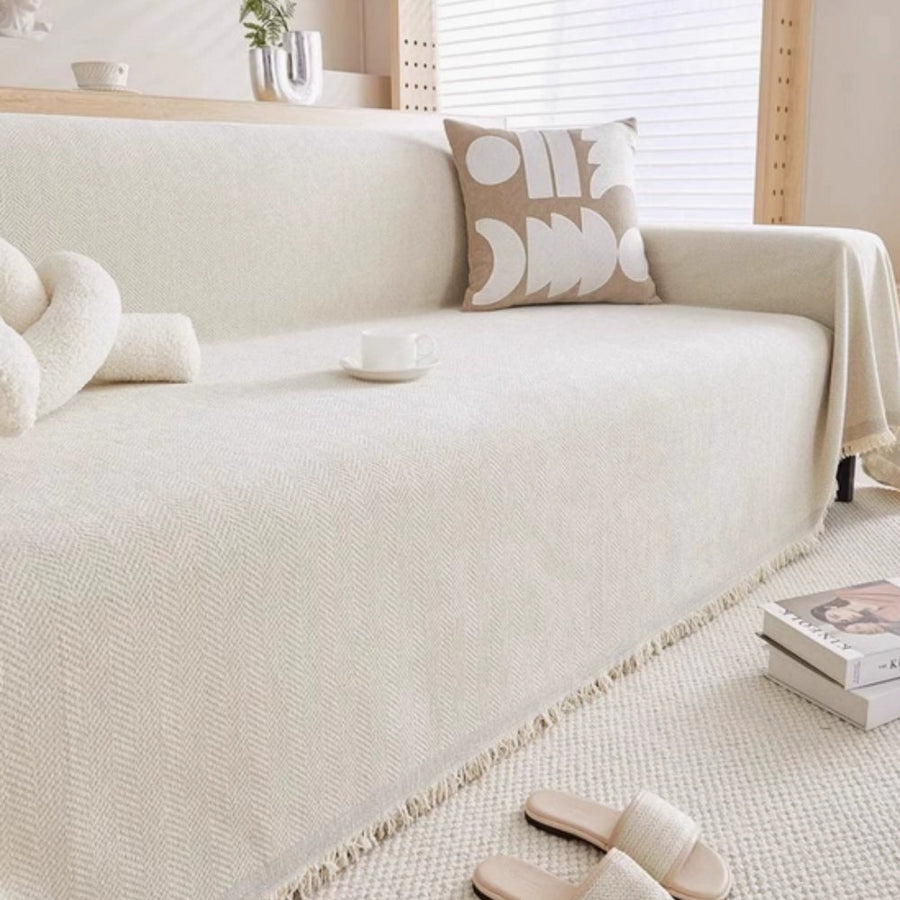 Blue textured sofa cover styled in a cozy living room