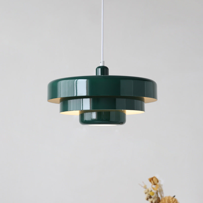 Pink retro pendant light in a cozy bedroom