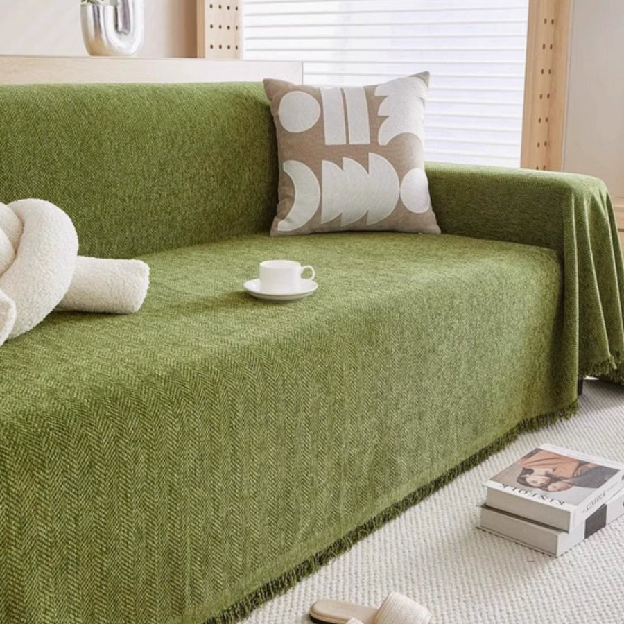 Close-up view of the sofa cover's textured fabric