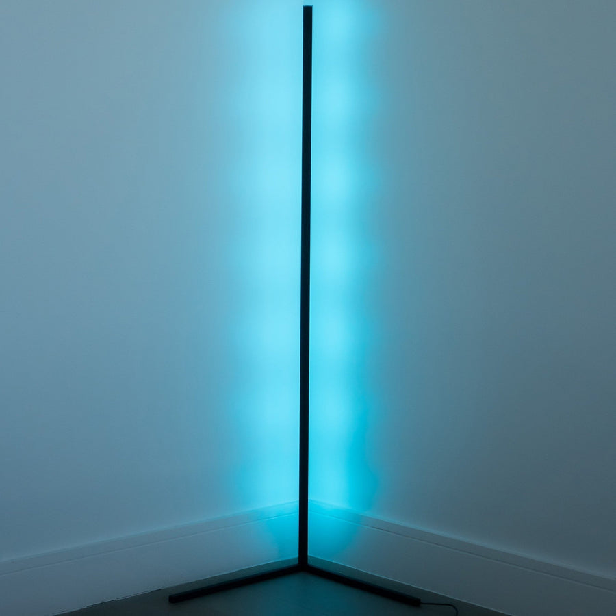 Corner floor lamp illuminating a reading nook