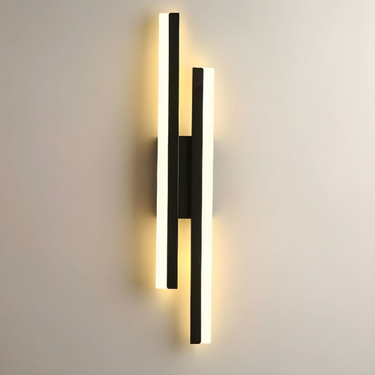 Modern linear LED wall sconce mounted on a bedroom wall