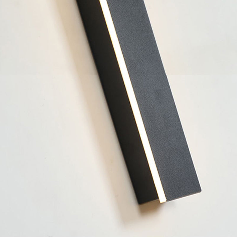 Wall light casting a soft glow on a stone wall