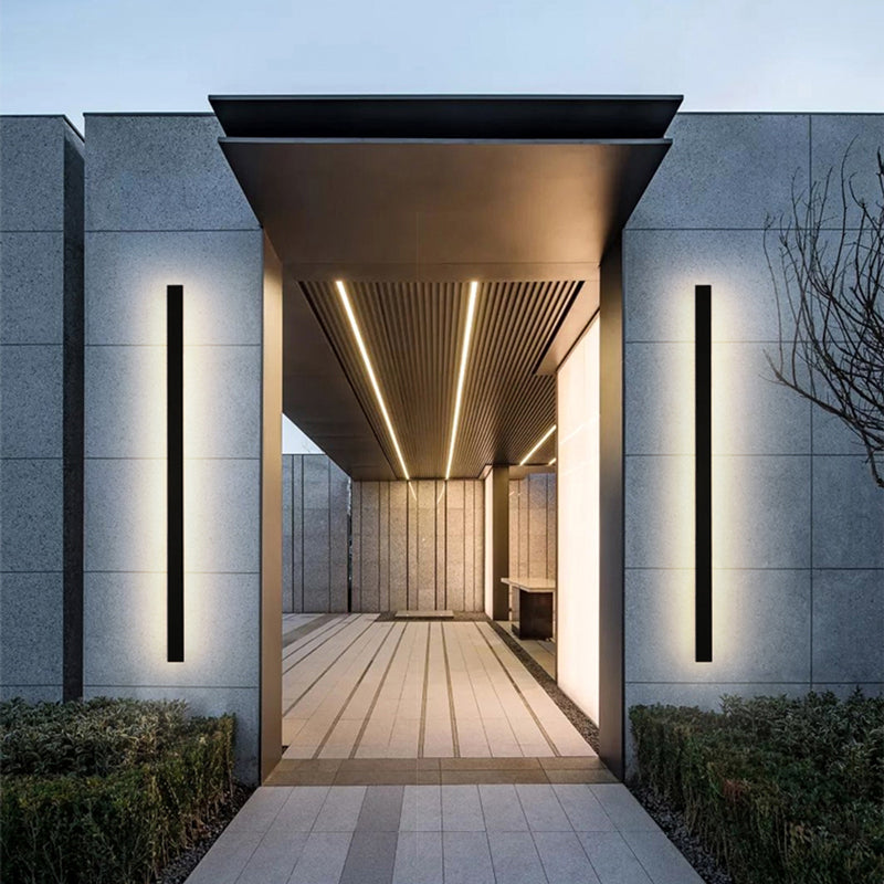 Wall light installed beside a front entry door