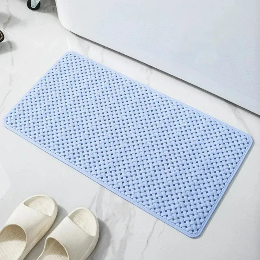 Person stepping on a non-slip shower mat with bare feet