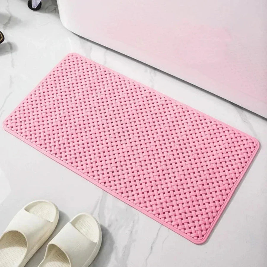 Shower mat in pink color shown in a modern bathroom