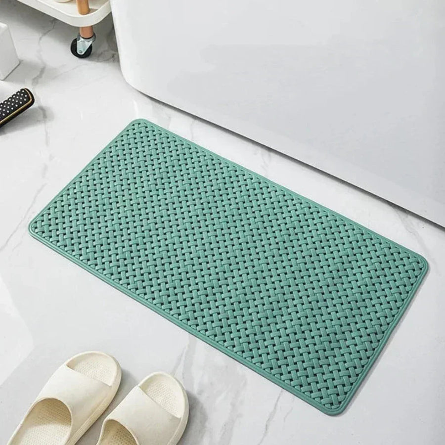 Close-up of water beading off the shower mat surface