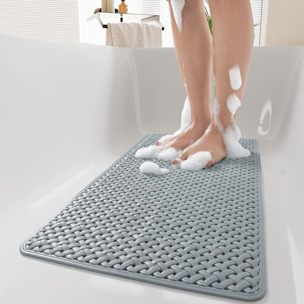 Non-slip shower mat with suction cups on a bathroom floor
