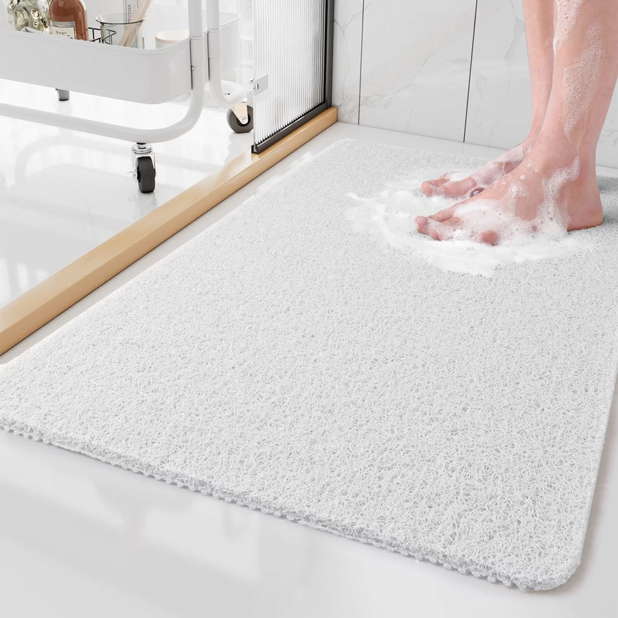 Shower mat folded to show its thickness and edge