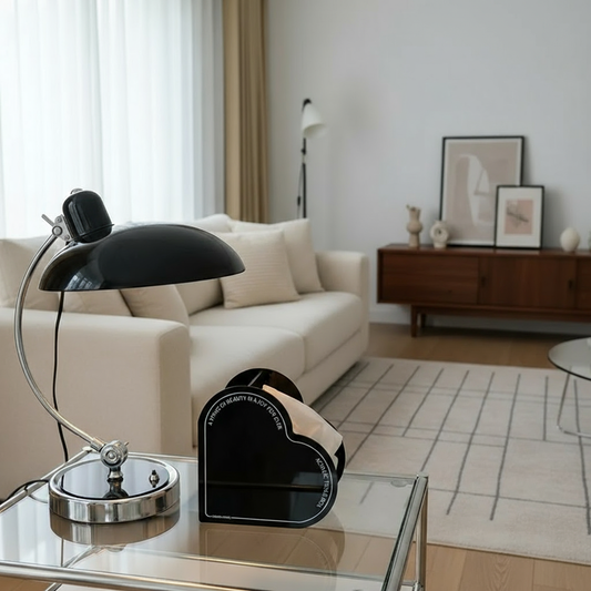 Scandinavian minimalist desk lamp with a curved metal arm