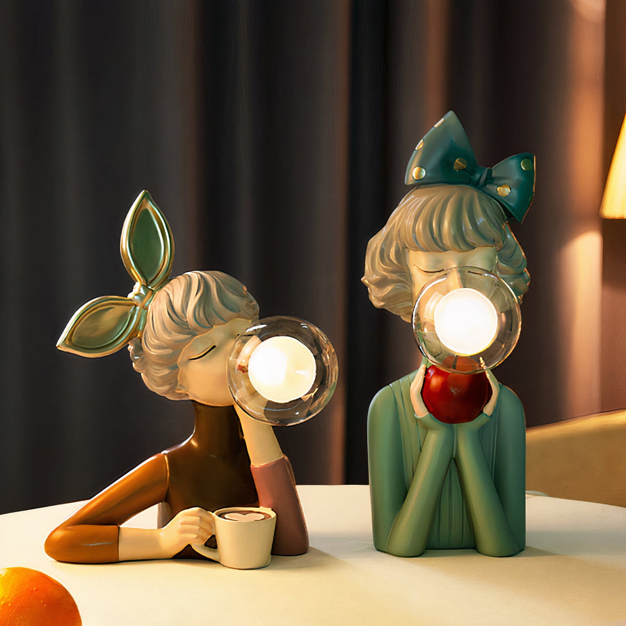 Table lamp lit on a bedside table in a bedroom