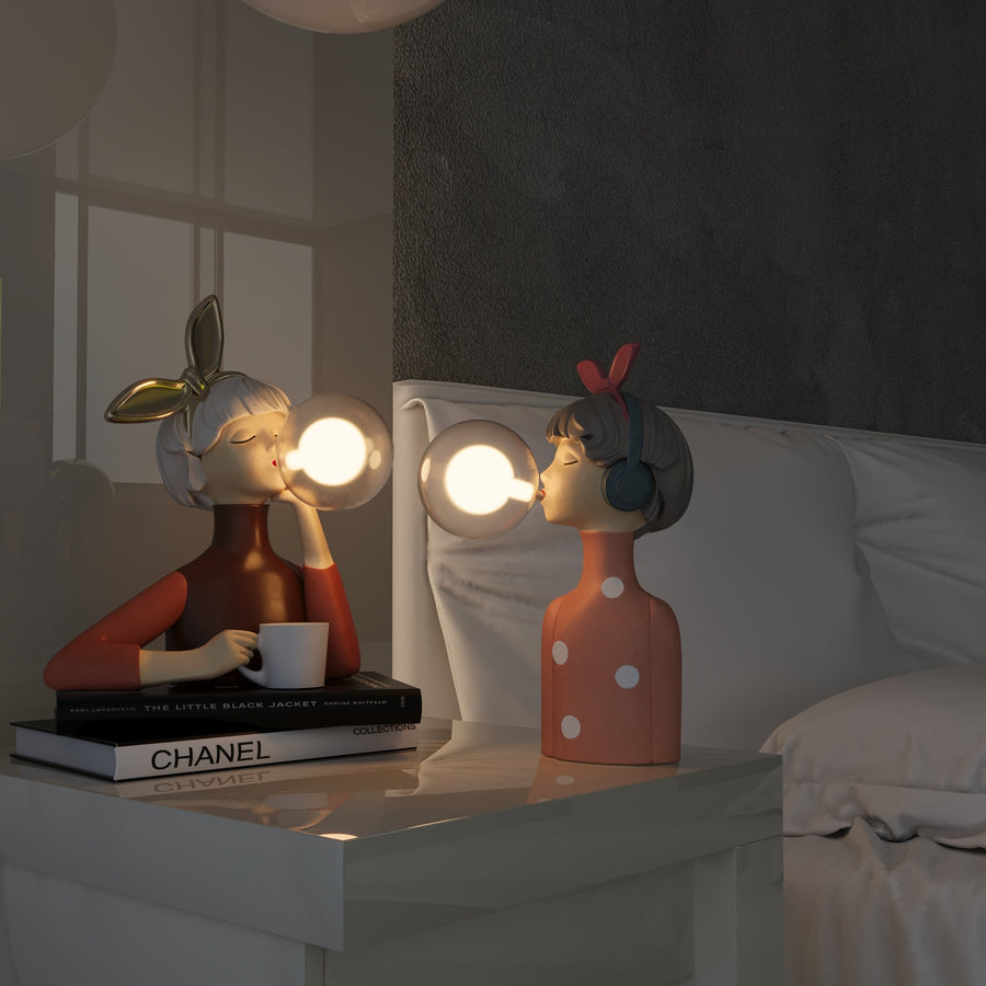 Table lamp shown next to a book and plant