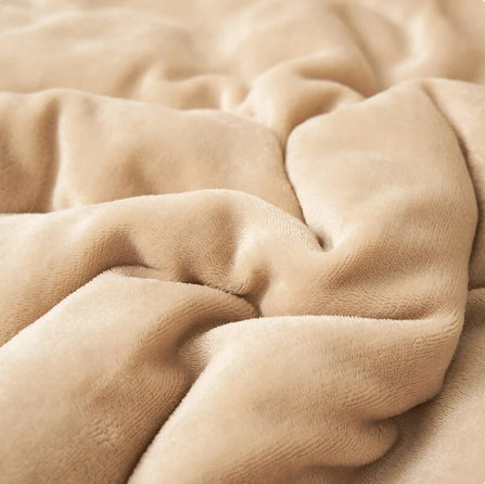 Blanket draped over a chair in a living room
