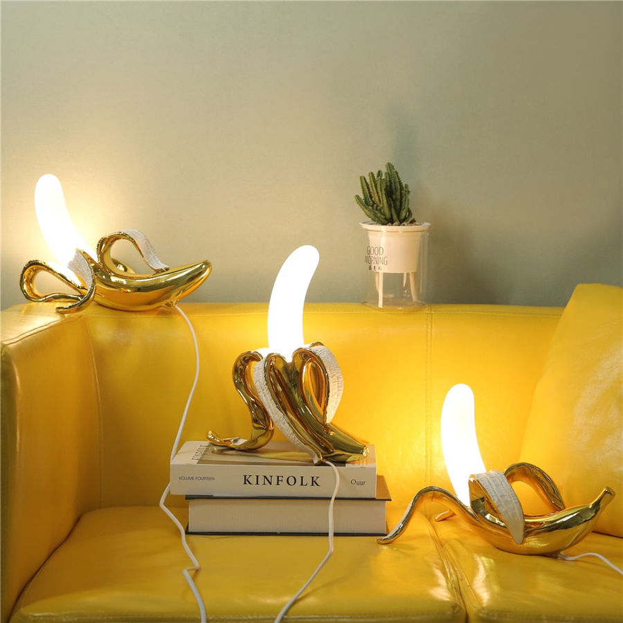 Banana table lamp lit up in a dark room