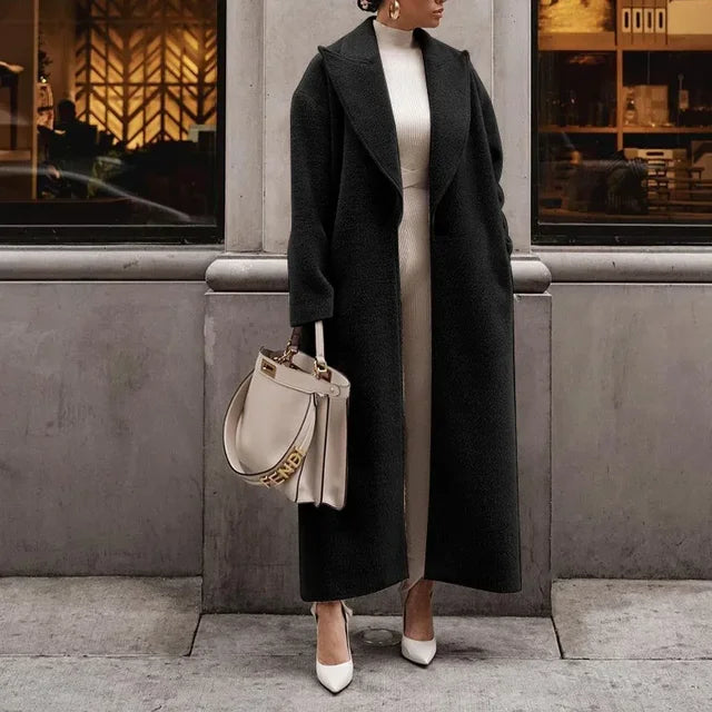 Woman wearing a classic oversized coat, front view