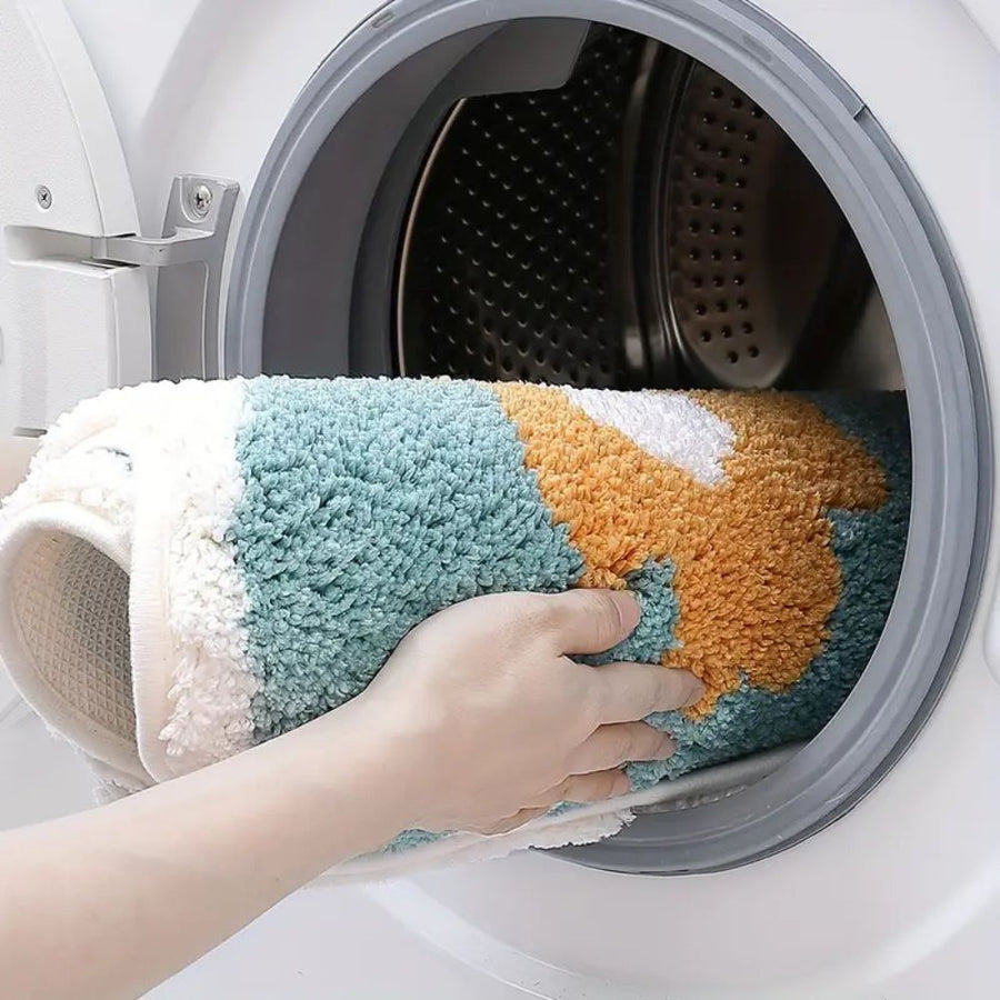 Non-slip floral bath mat placed beside a sink
