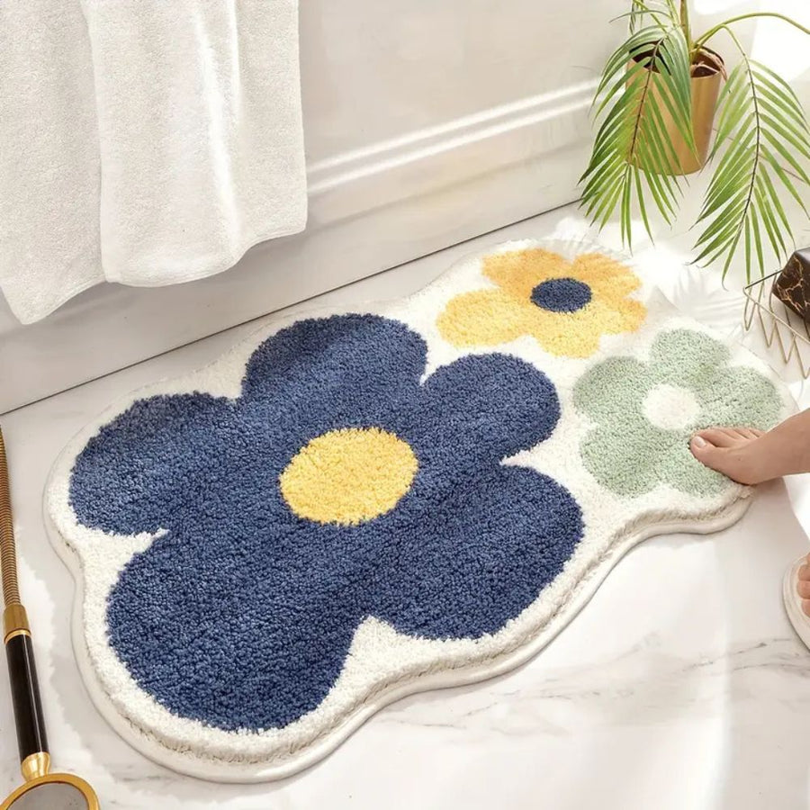 Non-slip floral bath mat shown next to a bathtub