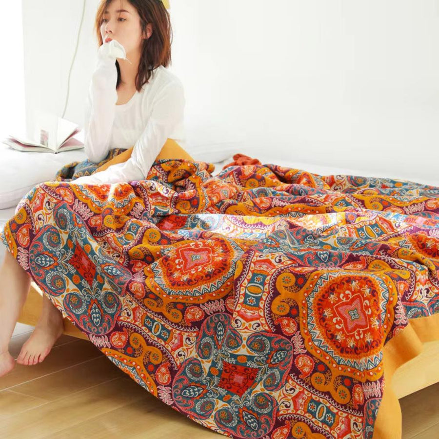 Reversible boho throw blanket showing its floral pattern