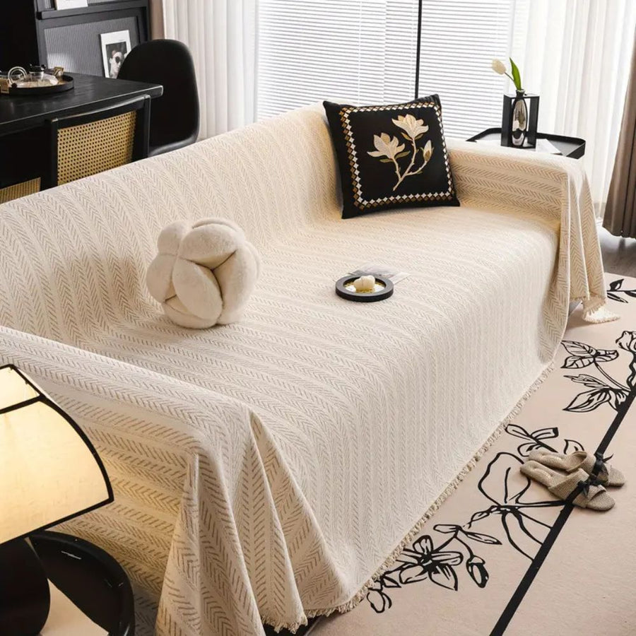 Folded textured modern sofa cover on a table