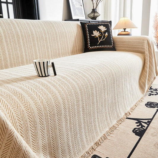 Textured modern sofa cover draped over a couch